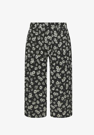 Pantalon noir à jambes larges avec un motif floral complet de marguerites blanches et une taille haute élastique.