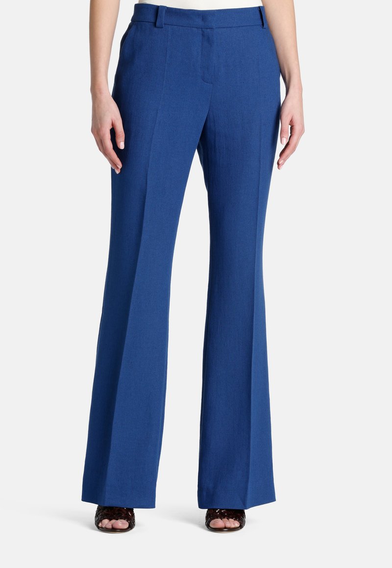Blauwe linnen broeken met een tailored ontwerp, wijdvallende pijpen en een platte voorkant. Voorzien van lussen voor de riem en zijzakken. Soepele textuur.