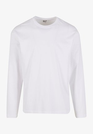 T-shirt blanc à manches longues en coton doux, doté d'un col rond et d'un design épuré et sans couture sans motifs graphiques ni embellissements.