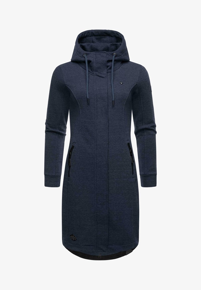 Tumedat sinine pikk kapuutsiga jope, millel on kõrge krae, reguleeritav kapuuts, külgedel tõmblukuga taskud ja ümar äär. Pehme kangas tekstureeritud viimistlusega.