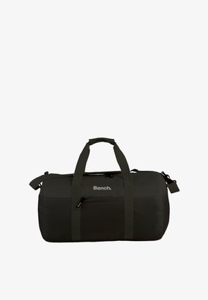Sporttasche aus dunkelgrünem Stoff mit zwei Traggriffen und einem Schultergurt. Verfügt über ein Mesh-Panel und ein dezentes "Bench."-Logo.