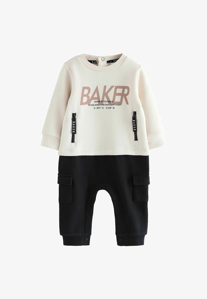 Dviejų dalių apranga kremine ir juoda spalva, su dideliu "BAKER" logotipu, kišenėmis su užtrauktukais ir snapų uždarymu kulkšnėse. Minkšta medžiaga.