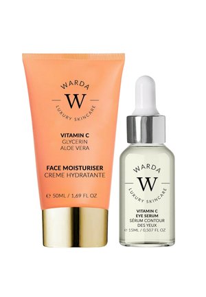 Zestaw luksusowych produktów do pielęgnacji skóry Warda: nawilżający krem do twarzy z witaminą C w pomarańczowej tubce oraz serum pod oczy z witaminą C w przezroczystej buteleczce z kroplomierzem.