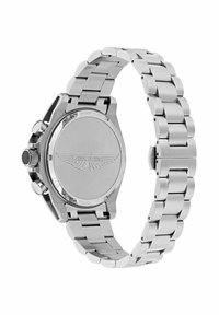 Nerūsējošā tērauda rokas pulkstenis ar matētu apdari, apaļa korpusa forma un saistītu joslu. Iekļauta izteikta krona un iegravēts logotips aizmugurē.