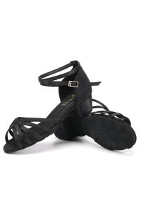 Black strappy dance shoes with a low heel, featuring crossed straps on the upper and a subtle textured sole for grip. Adjustable ankle strap.