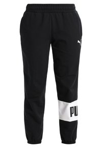 Zwarte Puma-sweatpants met een elastische tailleband en boorden, witte blok bij de rechterenkel met gedeeltelijke "PUMA" branding.