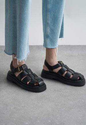 MICHAEL Michael Kors INDY FISHERMAN - Sandali con plateau - black