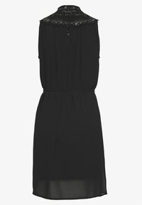 Black sleeveless dress with a lace yoke, gathered waist, and a button closure at the back. Smooth fabric with a flowy silhouette.