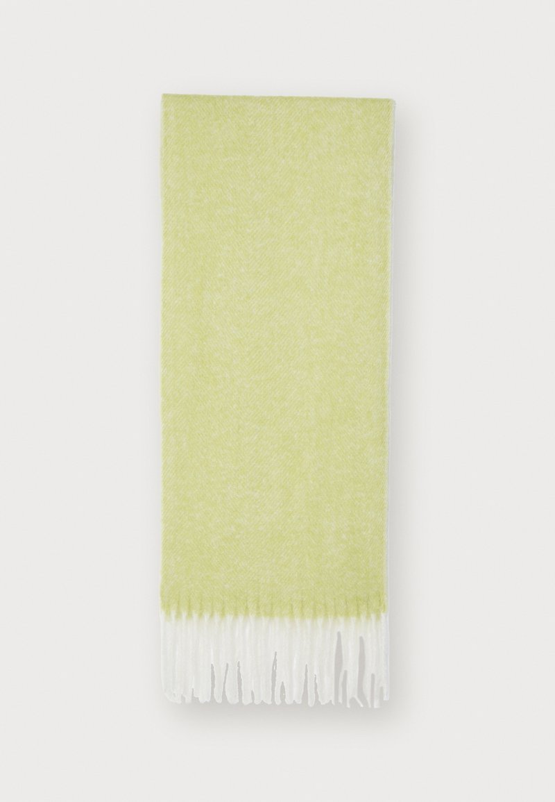 Lys grøn frynset tørklæde i blødt, struktureret stof med et herringbone-mønster, der har hvide frynser i enderne for ekstra detaljer.
