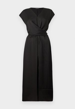 Black wrap dress with short sleeves, V-neckline, and a tie belt at the waist. Smooth, lightweight fabric; flowing skirt with a side slit.