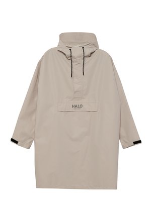 Lyst beige anorak med høj hals, sorte snore, forlomme og kontrastfyldte sorte detaljer ved manchetterne. Glat, vandafvisende stof.
