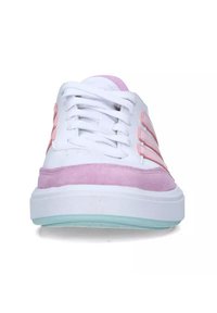 White sneaker with pink suede accents, featuring a chunky white sole and pink-striped design on the sides. Laces are white.