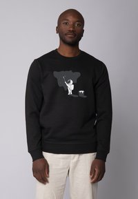 Zwarte sweatshirt met een ronde hals, voorzien van een witte afbeelding van een astronaut die een sterrenhemel schildert. Soepele stof, geribde manchetten.