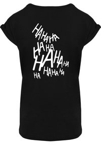 Black t-shirt featuring white "HAHA" text in varying sizes and orientations, with short sleeves and a rounded neckline. Soft cotton material.