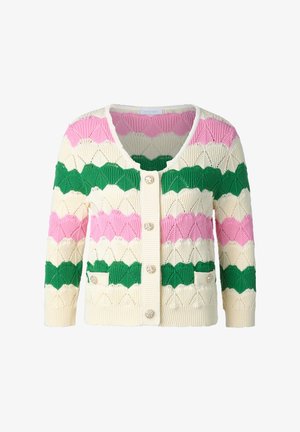 Neulecardigan, jossa on hymyilevä kuvio vihreänä, pinkkinä ja kermana, pyöreä kaula-aukko, etupainikkeet ja kaksi etutaskua.