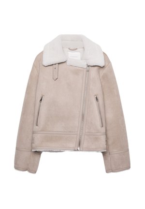 Beige Lammfelljacke mit weitem weißen Kragen, Reißverschluss, zwei Seitentaschen und eleganten Steppnähten an den Ärmeln.