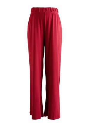 Red, wide-leg pants made from soft fabric with an elastic waistband. They feature a smooth texture and a flowing silhouette.
