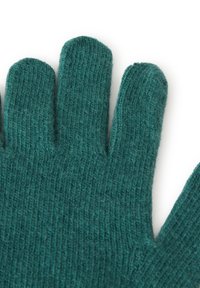 Tyrkysové pletené rukavice s měkkou texturou a přiléhavým tvarem. Každý prst je individuálně definován pro mobilitu a pohodlí.