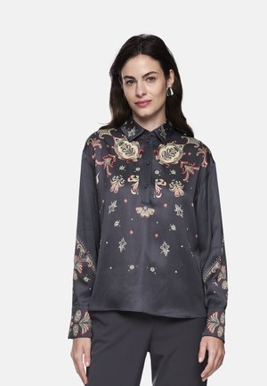 Long-sleeve blouse in dark gray satin, featuring intricate floral embroidery in red and cream, button placket, and collared neckline.