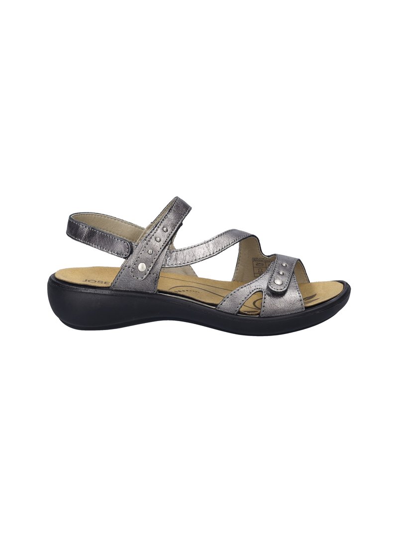 Metallic silver sandal with crisscross straps, decorative studs, padded footbed, and a black platform sole. Open-toe design.