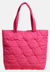 Torebka typu tote w jasnoróżowym kolorze, z okrągłym wzorem i dwoma solidnymi uchwytami. Wykonana z miękkiego materiału o wyściółkowanej teksturze.