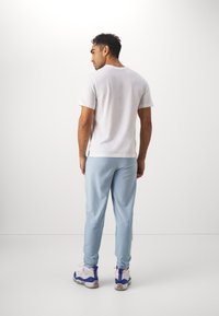 Jordan JORDAN SPORT - Treniņtērpa apakšdaļas - blue grey/black
