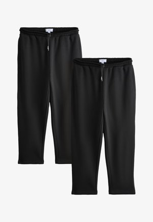 To sorte elastiske joggingbukser med snøre i taljen, tilspidsede ben, enkelt design, vist side om side på hvid baggrund.