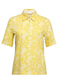 Gelbes Kurzarm-Polohemd mit floralem Muster in Weiß. Mit Kragen und einer Knopfleiste mit fünf Knöpfen, strukturiertem Stoff.