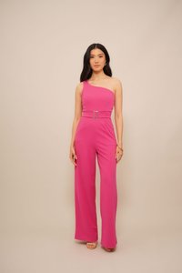 Fuchsia jumpsuit featuring a one-shoulder design, belted waist with a square buckle, and wide-leg cut. Smooth fabric texture.