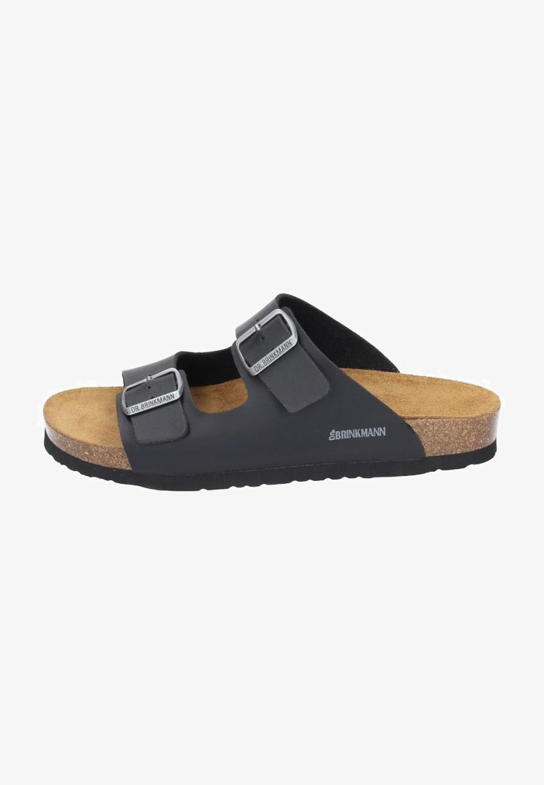 Black slide sandal featuring two adjustable straps with silver buckles, a cork footbed, and a textured rubber sole.