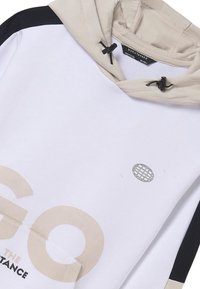 Felpa con cappuccio in bianco, beige e nero. Caratterizzata da una grande stampa del logo, tasca frontale e dettaglio con lacci sul cappuccio. Tessuto morbido.
