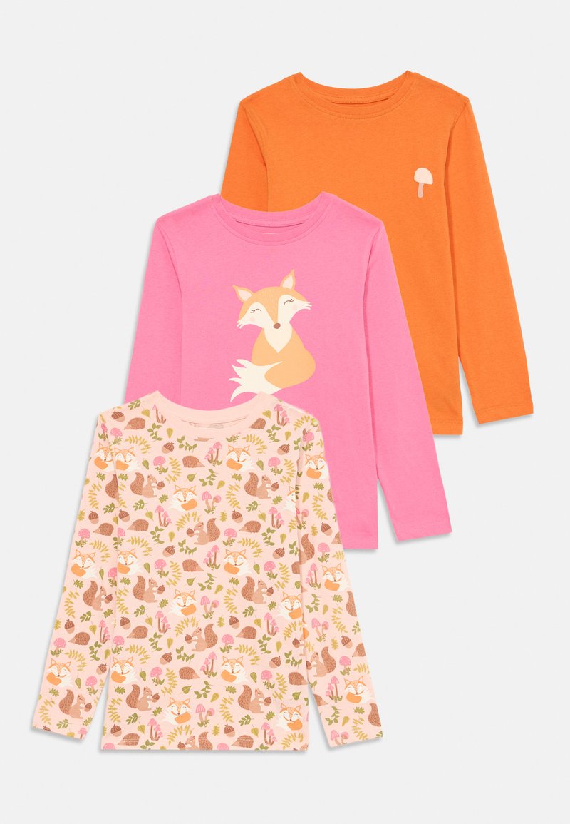 Three long-sleeve shirts: one orange, one pink with a fox graphic, and one light pink with nature-themed patterns of animals and plants.