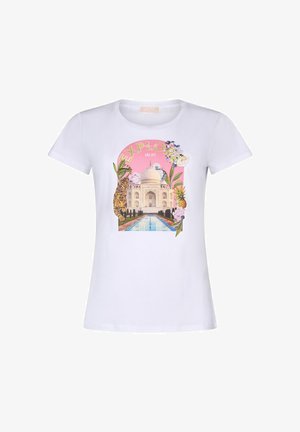 White T-shirt with "EXPLORE" text above Taj Mahal, surrounded by tropical plants, flowers, a tiger, and a pineapple on a pink background.