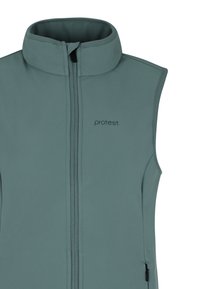 Beżowy bezrękawnik w jasnym odcieniu niebieskiego, wykonany z miękkiego, elastycznego materiału z wysokim kołnierzem i zapięciem na zamek błyskawiczny. Posiada subtelne logo na piersi.