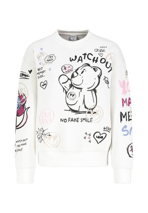 White sweatshirt featuring a black bear graphic, colorful doodles, and text like "WATCH OUT" and "NO FAKE SMILE." Soft texture, casual fit.