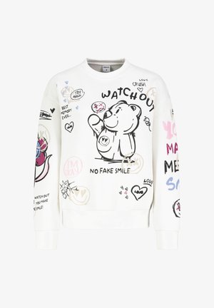 White sweatshirt featuring a black bear graphic, colorful doodles, and text like "WATCH OUT" and "NO FAKE SMILE." Soft texture, casual fit.