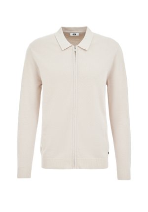 Smėlio spalvos megztinis kardiganas su lygiu megztu apykakliu, pilnu užtrauktuku ir ribotais rankogaliais. Audinys su tekstūra ir subtiliomis siūlių detalėmis ant kūno.