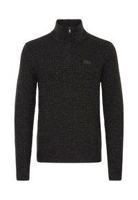 Mørkegrå strikket sweater med høj krave og en kort lynlås. Har en tekstureret stofoverflade og et lille mærke på brystet.