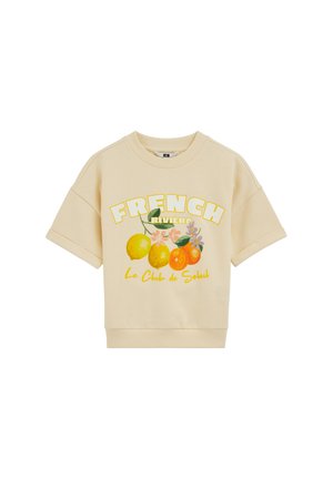Bézs rövid ujjú pulóver "FRENCH RIVIERA" felirattal, citrom és narancs illusztrációval, valamint "Le Club de Soleil" felirattal az elején.