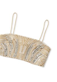 Beige stoffen bandeau met ingewikkelde witte borduursels en zilveren accenten in golvende patronen. Inclusief twee dunne bandjes.