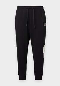 Μαύρο παντελόνι jogger με ελαστική μέση και κορδόνι, διαθέτει πλαϊνές τσέπες, μανσέτες στους αστραγάλους και μικρό λευκό λογότυπο στο πάνω μέρος του μηρού.