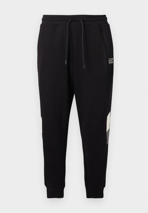 Μαύρο παντελόνι jogger με ελαστική μέση και κορδόνι, διαθέτει πλαϊνές τσέπες, μανσέτες στους αστραγάλους και μικρό λευκό λογότυπο στο πάνω μέρος του μηρού.