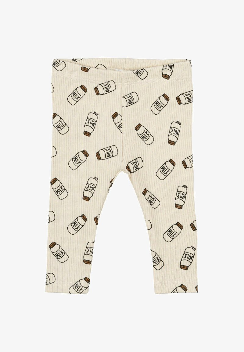 Leggings côtes crème avec un motif répété de bouteilles de lait en brun et noir, dotés d'une taille élastique pour plus de confort.