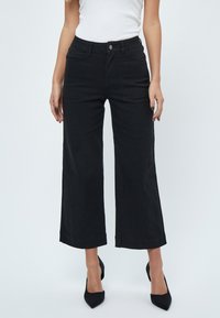 DEFLORENCE PANTS - Jeans Bootcut - black
