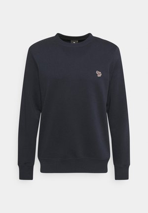 Granatowa bluza z okrągłym dekoltem, długimi rękawami i małym, wielokolorowym haftowanym logo zebry na lewej piersi.