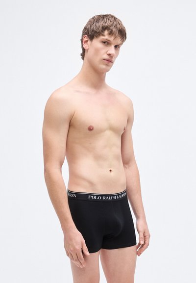 Crne bokserice od pamuka s elastičnim pojasom na kojem je logo "POLO RALPH LAUREN". Kratki, pripijeni dizajn.