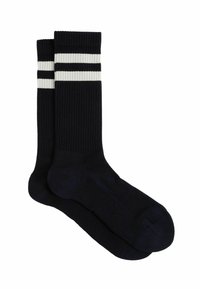 Marineblaue gerippte Socken mit weißen Streifenakzenten am oberen Rand, ausgestattet mit einer glatten Oberfläche und einem Standard-Crew-Längen-Design.