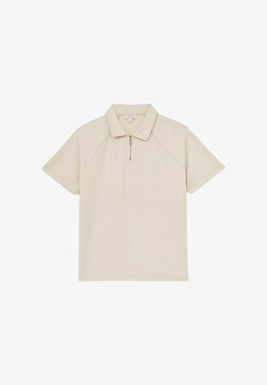Beige lyhythihainen polo-paita, jossa on vetoketjukaula, pehmeä rakenne ja raglan-hihat, suunniteltu rentoon istuvuuteen.