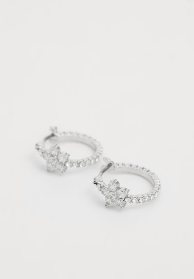 Silver hoop earrings with a floral design, featuring multiple clear rhinestones and a smooth polished finish.