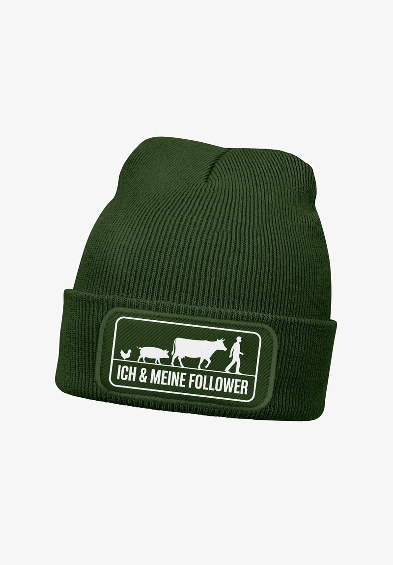 Green knitted beanie with a folded hem. Features a patch depicting animals (chicken, pig, cow) and a person, with the text "ICH & MEINE FOLLOWER."